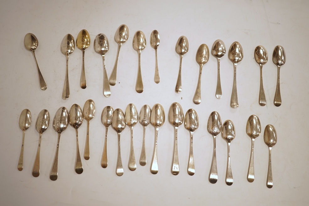 A collection of twenty nine assorted Georgian picture back teaspoons, various dates and makers, including three with masted ship, some marks indistinct, 10.2oz.